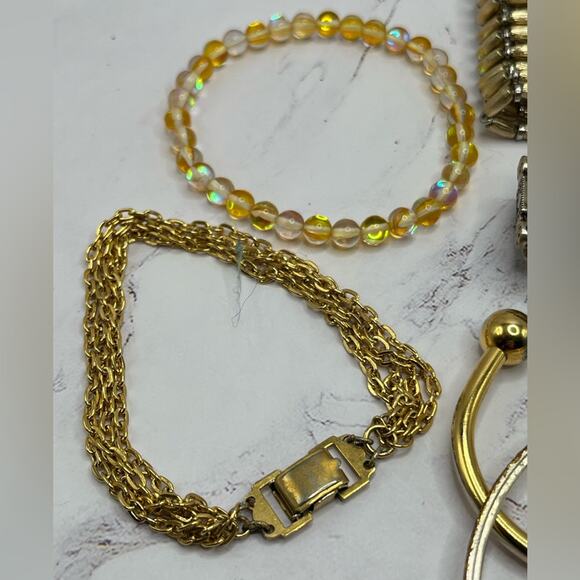 10 assorted style gold tone bracelets - Picture 8 of 12